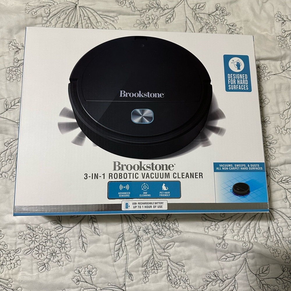 NEW Brookstone 3-in- 1 Robotic Vacumm
Cleaner